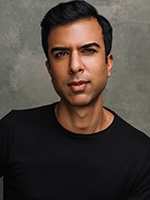 Soman Chainani headshot with him wearing a black shirt against a gray background