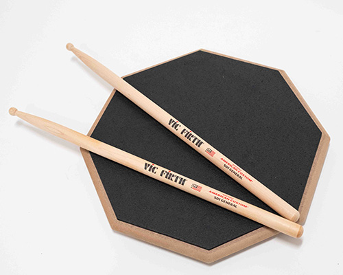Double-sided practice pad and one set of drumsticks