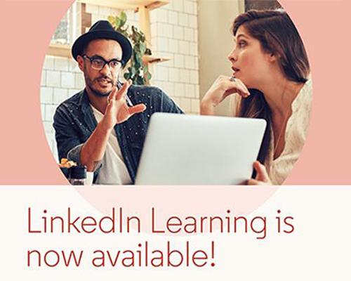 LinkedIn Learning is now available. Two people sitting with a laptop.