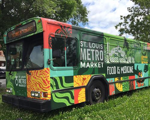 Colorful St. Louis Metro Market Bus parked in the grass