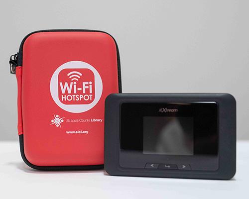 Black hotspot and red SLCL portable case against white backdrop